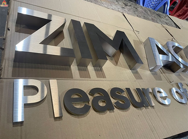 Gia công chữ inox trắng Zim Academy